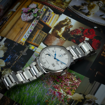 Glashütte Original Senator Excellence 1-36-02-01-02-61 dial and polished stainless steel bracelet links on a decorative