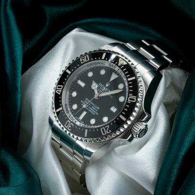 Rolex Sea-Dweller Deepsea 126660, close-up of the watch face, bezel, crown, and part of the steel bracelet.