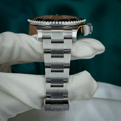 Rolex Sea-Dweller Deepsea 126660 bracelet and clasp on a display pillow, viewed from the top.