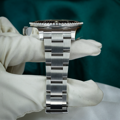 Rolex Sea-Dweller Deepsea 126660, side profile of the watch case and metal bracelet links.