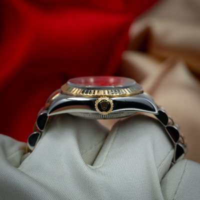 Rolex Oyster Perpetual Lady 67193, side view showing the fluted bezel and crown with Rolex logo.