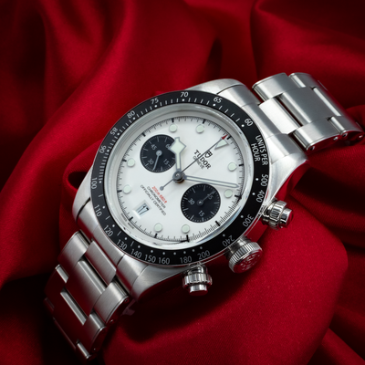 Tudor Black Bay Chrono M79360N-0002 dial and bezel close-up, showing white dial, black subdials, and date window.