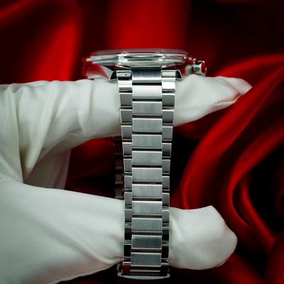 Omega Speedmaster 57 Chronograph 332.10.41.51.10.001, side view of the watch and bracelet on a gloved hand.