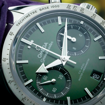 Omega Speedmaster 57 Chronograph 332.10.41.51.10.001, close-up of the green dial and silver hands.