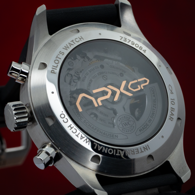 IWC Pilot’s Watch Chronograph APXGP iw378009 caseback with visible movement and "APXGP" text.