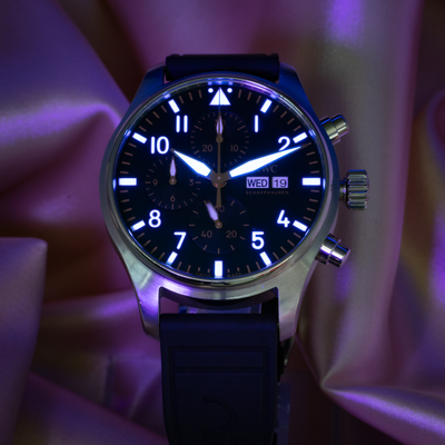 IWC Pilot’s Watch Chronograph APXGP iw378009 dial, glowing luminescent hour markers and hands on a black dial.