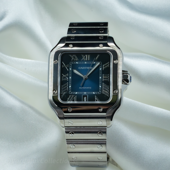 Cartier Santos WSSA0063 watch with blue dial and polished steel case, featuring Roman numerals.
