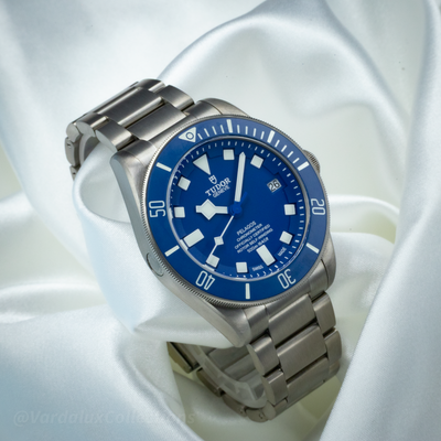 Tudor Pelagos Blue Titanium M25600TB-0001 dial and titanium bracelet on white silk.