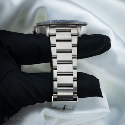Tudor Pelagos Blue Titanium M25600TB-0001, brushed titanium bracelet and clasp on a black glove.