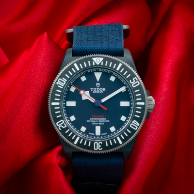Tudor Alinghi Red Bull Pelagos Fxd – Racing M25707KN dial, dark blue with white markers and red accents.