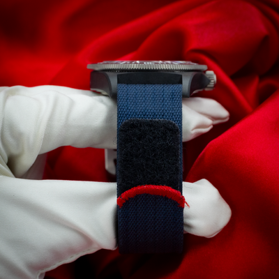 Tudor Alinghi Red Bull Pelagos Fxd – Racing M25707KN watch with a blue textile strap and red stitching detail.