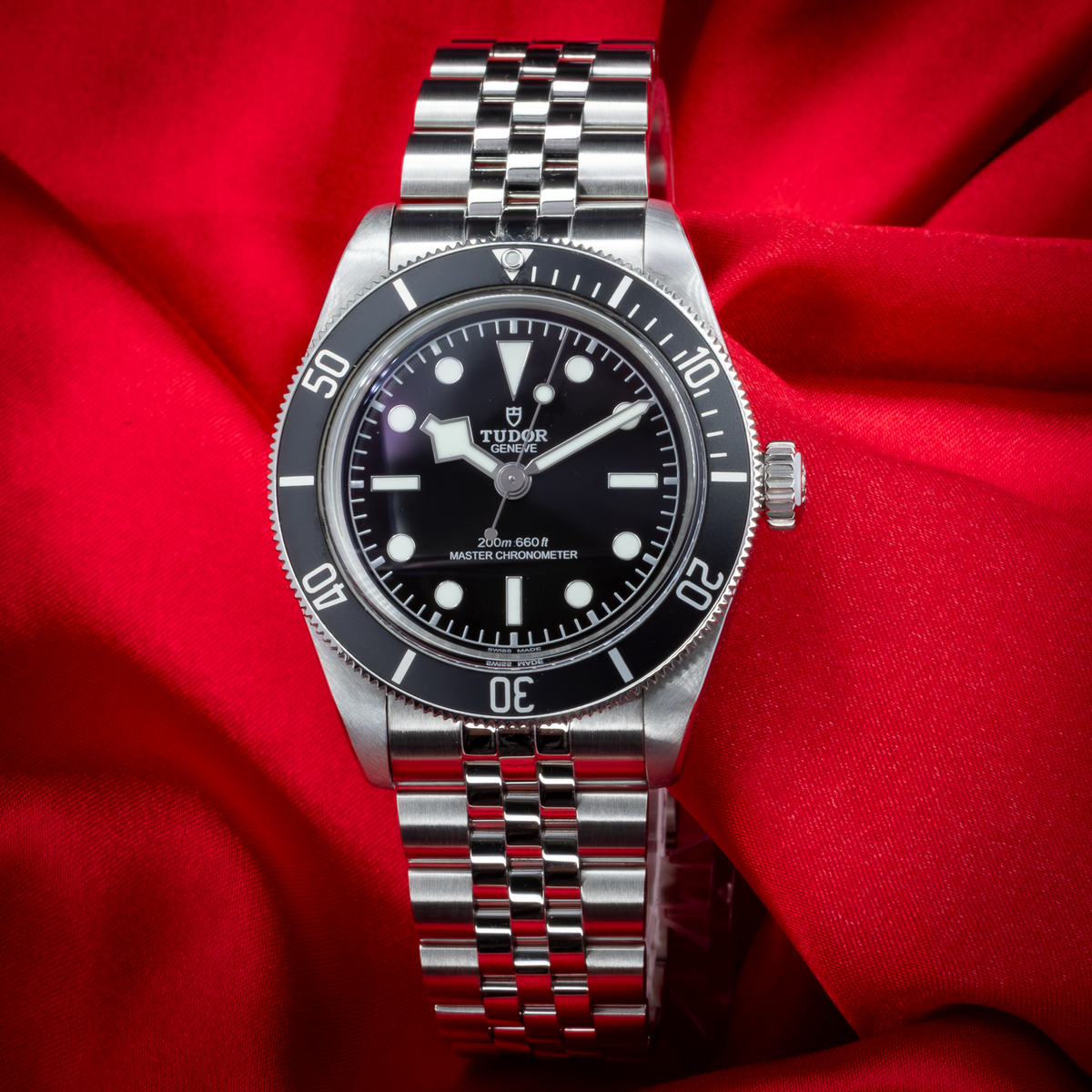 Tudor Black Bay 41mm M7941A1A0NU-0003, full overhead view of the watch dial, bezel, and steel bracelet.