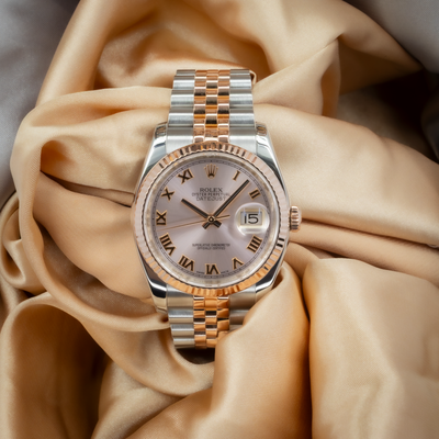 Rolex Datejust 36 116231 watch, champagne dial with Roman numerals and two-tone Jubilee bracelet.
