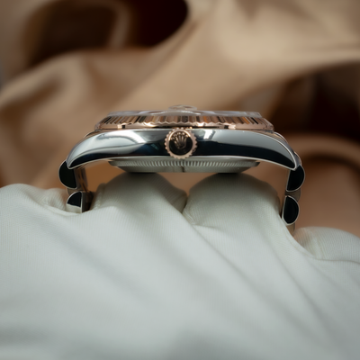 Rolex Datejust 36 116231, side profile view showing the crown, fluted bezel, and two-tone case details.