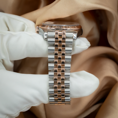 Rolex Datejust 36 116231 watch, side view showing the jubilee bracelet and rose gold fluted bezel.