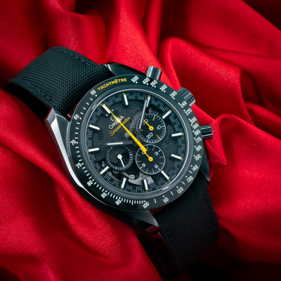 Omega Speedmaster Dark Side Of The Moon 311.92.44.30.01.001 watch with black dial and yellow hands.