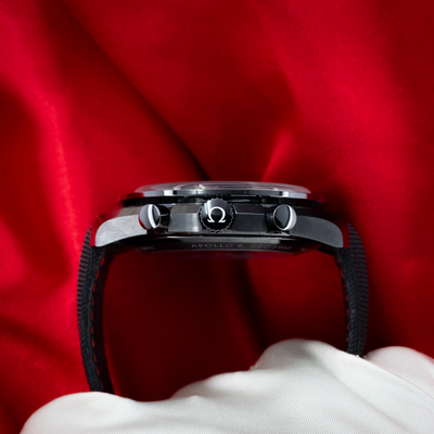 Omega Speedmaster Dark Side Of The Moon 311.92.44.30.01.001, side view of the case with crown and pushers.