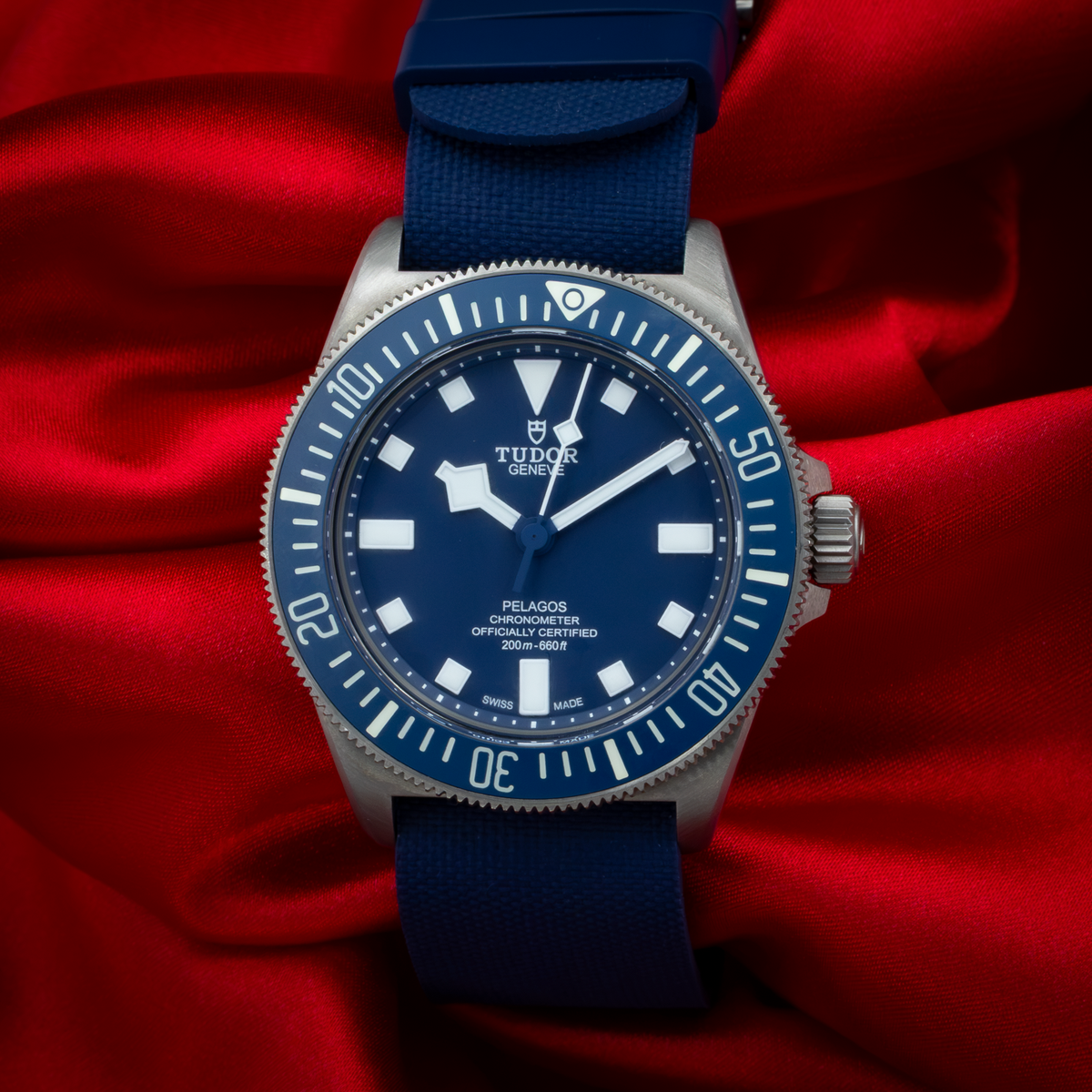 Tudor Pelagos FXD Marine Nationale 25707B/23-0001 with blue dial and bezel on a blue fabric strap.