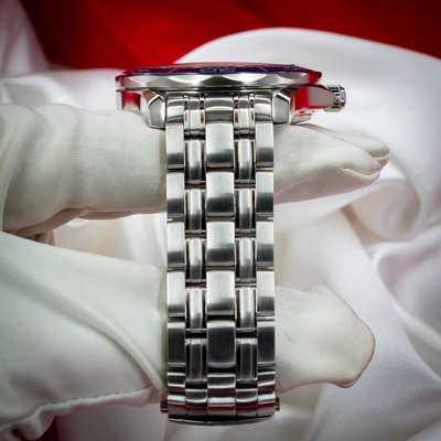 Omega Seamaster Diver 212.30.41.20.03.001, side view of case and metal bracelet.