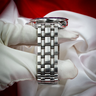 Omega Seamaster Diver 212.30.41.20.03.001 side profile and bracelet on white glove.