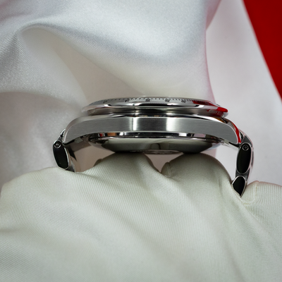 Omega Speedmaster Date 3513.30.00 watch, side view of the polished case and bezel with tachymeter markings.