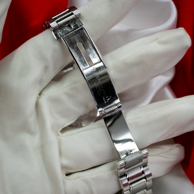 Omega Speedmaster Date 3513.30.00 clasp interior showing stamped text details, bracelet.
