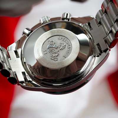 Omega Speedmaster Date 3513.30.00, stainless steel caseback with hippocampus logo and serial number.
