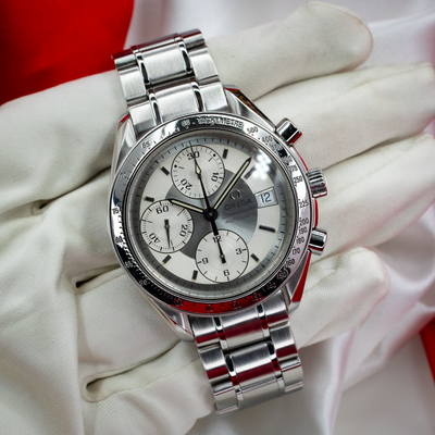 Omega Speedmaster Date 3513.30.00, close-up of the dial with chronograph subdials, date window, and tachymeter bezel.