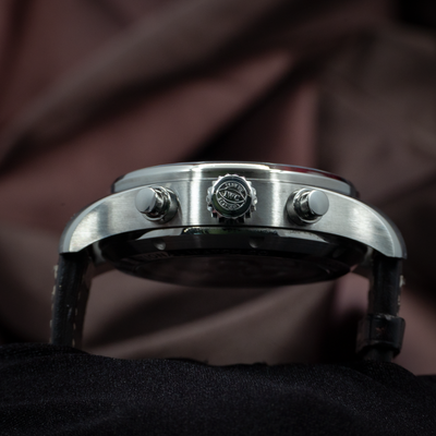 IWC Pilot Chronograph IW388101 crown and pushers visible from the side, with a black strap.