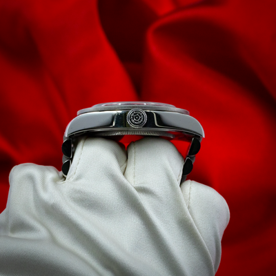 Tudor Black Bay Fifty-Eight Blue M79030B-0001 side view with crown and bezel detail on gloved hand.