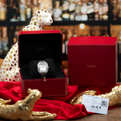 Cartier Santos De Cartier WSSA0029, watch in open red box with warranty card, red box, and leopard decor.