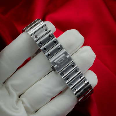 Cartier Santos De Cartier WSSA0029, watch bracelet clasp on gloved hand.