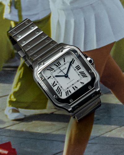 Cartier Santos De Cartier WSSA0029 watch dial and bracelet with Roman numerals on a white background.