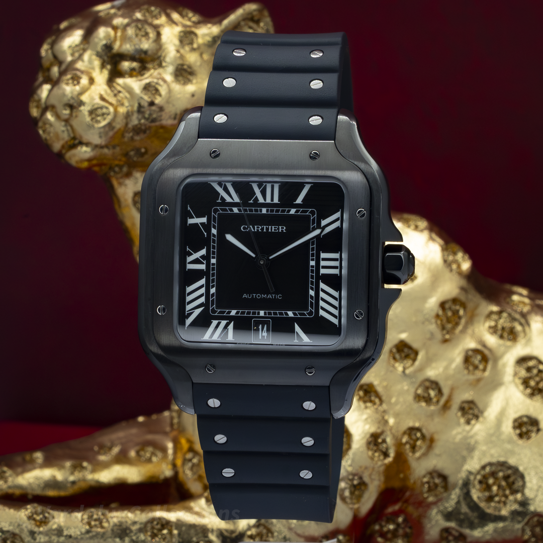 Cartier Santos De Cartier WSSA0039, black dial with white Roman numerals and date window, black rubber strap, case, and