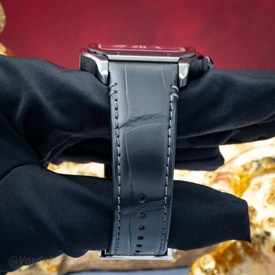Cartier Santos De Cartier WSSA0039 watch, case side and black leather strap with stitching.