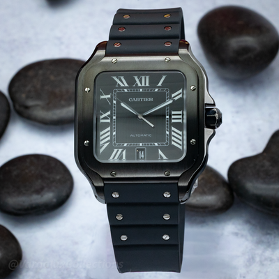 Cartier Santos De Cartier WSSA0039 watch with a black dial, Roman numerals, and date window.