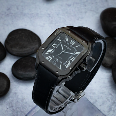 Cartier Santos De Cartier WSSA0039 watch, angled view of the dark dial with white Roman numerals.