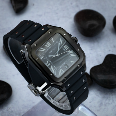 Cartier Santos De Cartier WSSA0039 watch with a black dial and a black rubber strap with a folding clasp.