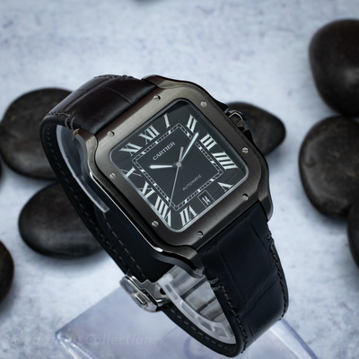 Cartier Santos De Cartier WSSA0039 watch showing a three-quarters view of the black dial and black leather strap.