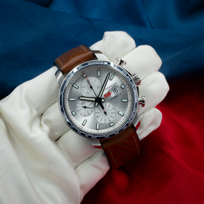 Chopard Mille Miglia Gts Race Edition 2022 168571-3010 watch, close-up of the silver dial and brown leather strap.
