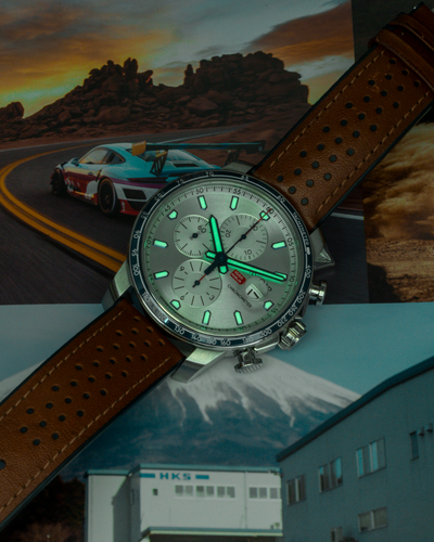 Chopard Mille Miglia Gts Race Edition 2022 168571-3010 dial with glowing hands and markers, and brown leather strap.