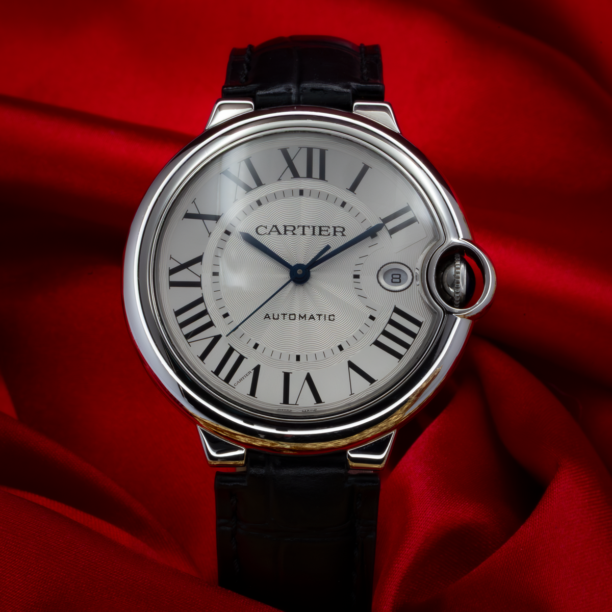 Cartier Ballon Bleu Silver Dial 40mm WSBB0039, a silver watch with a black leather strap and blue hands, dial.