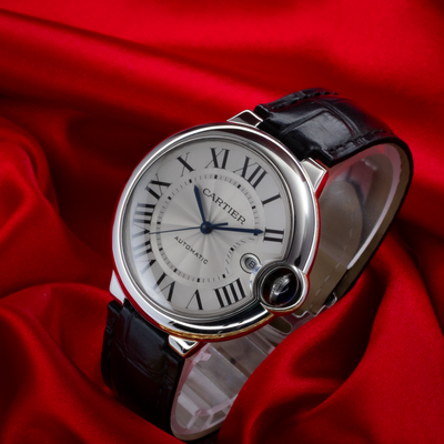 Cartier Ballon Bleu Silver Dial 40mm WSBB0039 watch dial, crown and black alligator strap on red silk.