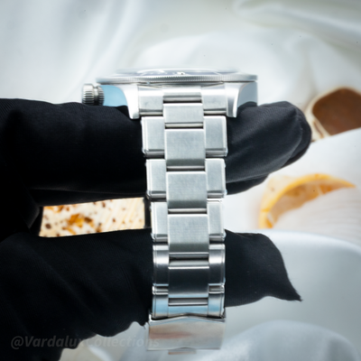 Tudor Black Bay 58 79030B watch, right side view showing the brushed metal bracelet links and watch case.