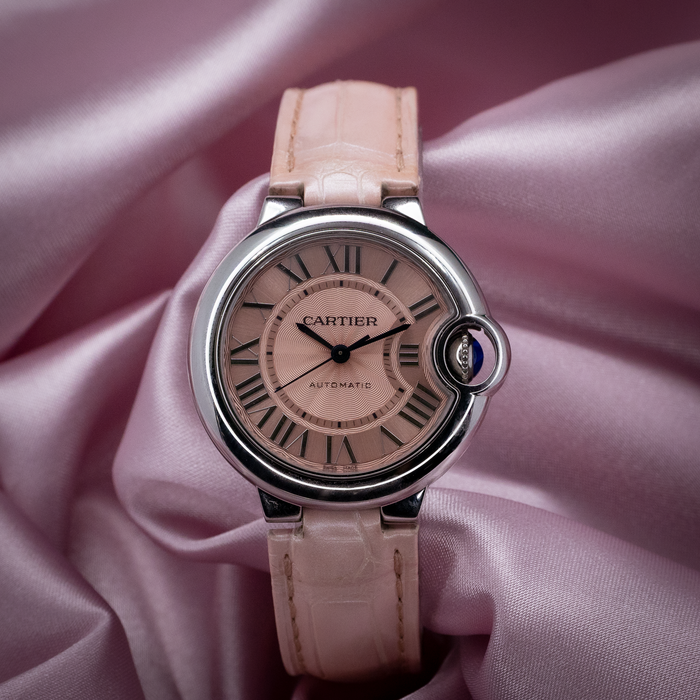 Cartier ballon bleu wsbb0002 watch, a full view of the light pink dial with Roman numerals and light pink leather strap.