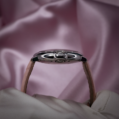 Cartier ballon bleu wsbb0002, side view of case and crown with a pink strap.