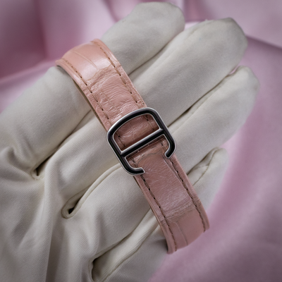 Cartier ballon bleu wsbb0002, pink alligator leather strap with steel deployant clasp on a gloved hand.