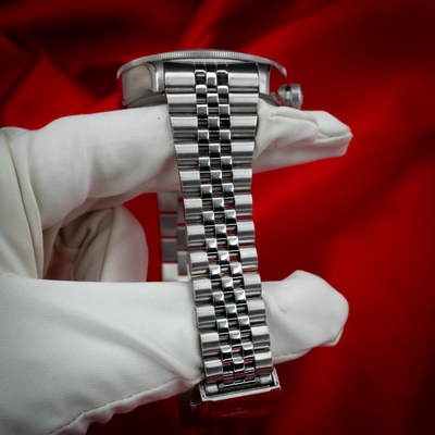 Tudor Black Bay GMT 79830RB, side profile of stainless steel watch head and bracelet.