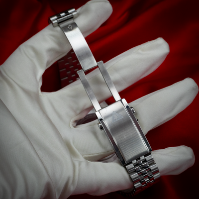 Tudor Black Bay GMT 79830RB bracelet and clasp, held by a gloved hand.