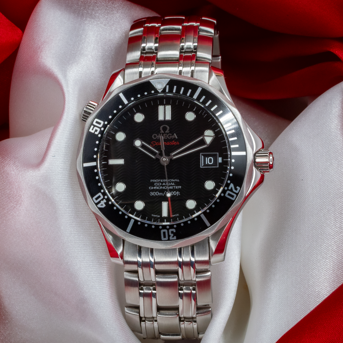 Omega Seamaster 212.30.41.20.01.002 watch with a detailed view of its black wave-patterned dial, silver hour markers, and